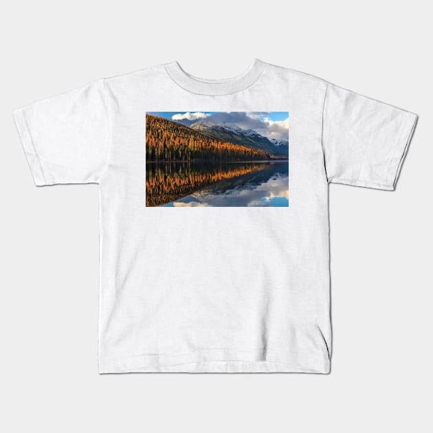 Mountain Peaks Reflect Into Bowman Lake In Autumn Glacier National Park Kids T-Shirt by HammiltenJohn